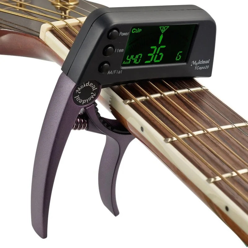 קאפו משולב עם טיונר מתאים לגיטרה אקוסטית חשמלית וקלאסית